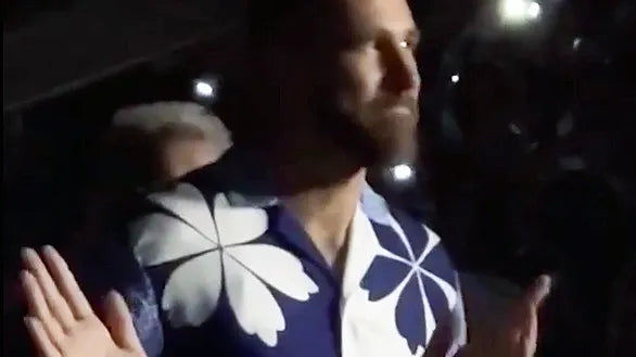 Travis Kelce wearing a J. Logan Home Maison shirt