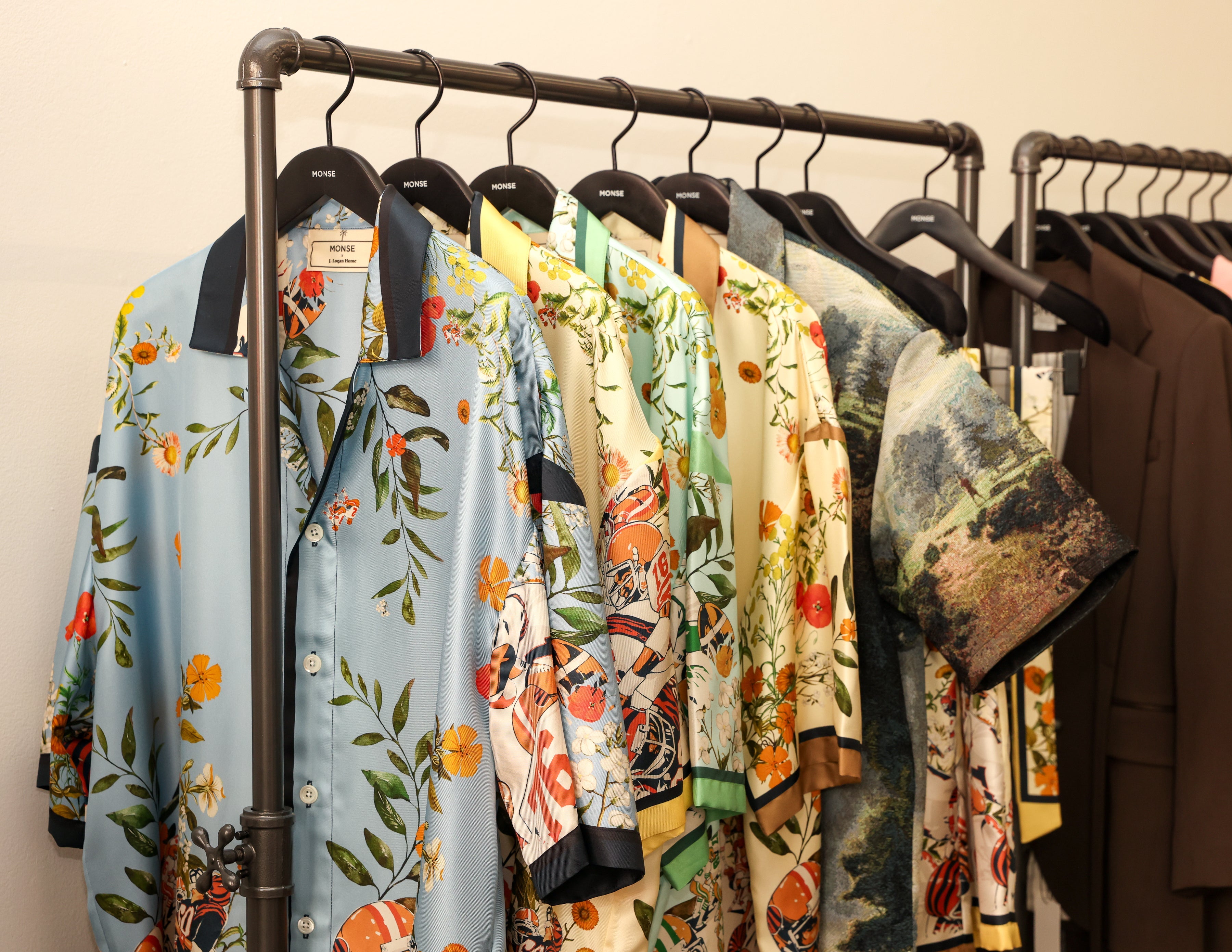 MONSE x J. Logan Home silk shirts on a rack, gridiron floral prints in blue, mint and butter