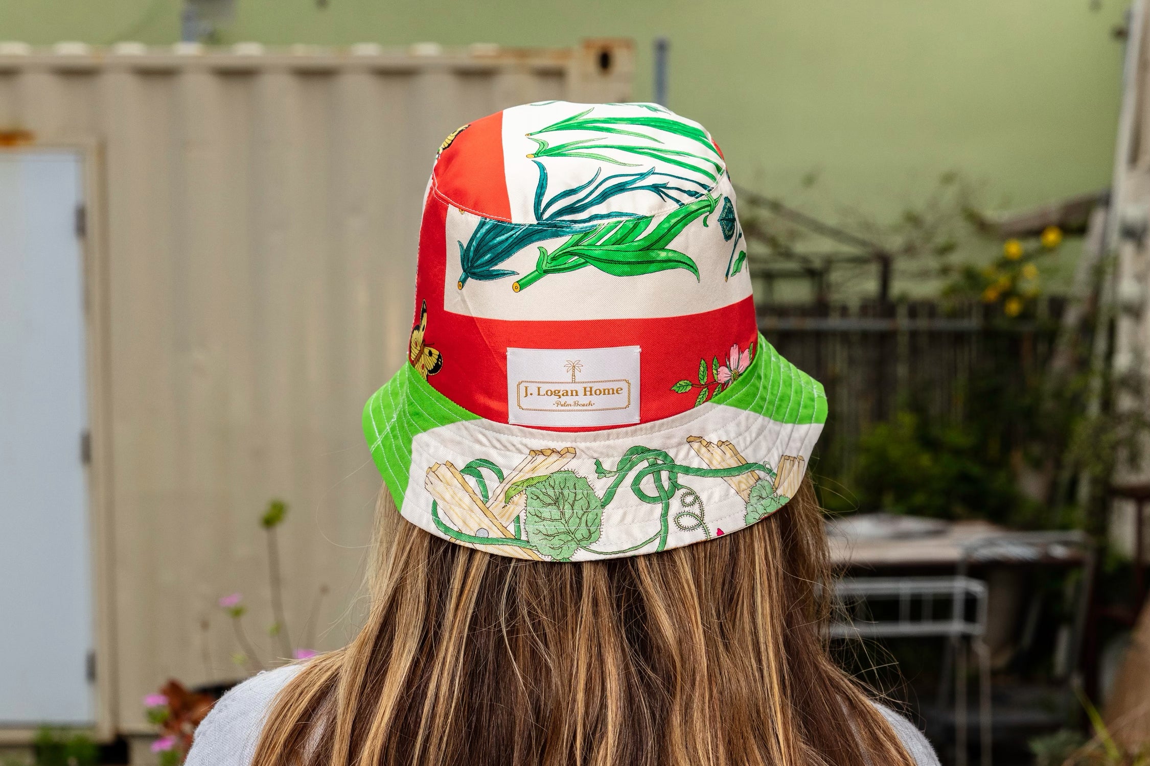 Model wearing a J. Logan Home reversible silk bucket hat